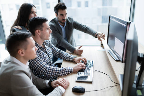 istock Picture of businesspeople working on computer together 883356452