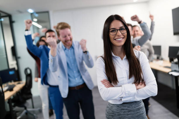 istock Group picture of business team posing in office 883360162