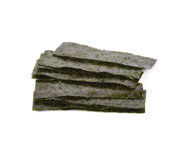 istock seaweed. dry seaweed on the background 883387374