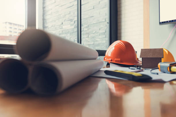 istock Engineer and Architect concept, Engineer Architects office in working day with blueprints, Vintage Effect 883533386