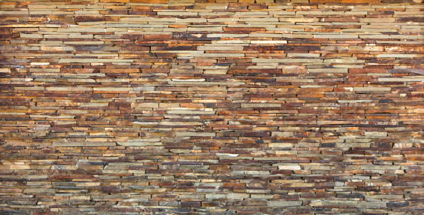 istock Fragment of artistic wall made with multiple stones 883534176
