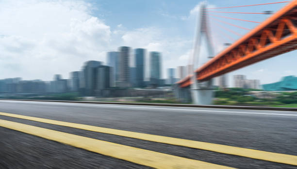 istock modern city skyline and empty urban road 883545060