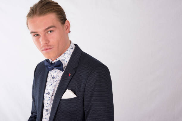 Young man in formal gear looking into camera. Young man in formal gear looking into camera. slicked back hair stock pictures, royalty-free photos & images