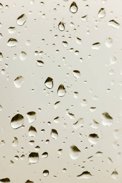 istock drops of rain on the window as a background 883552228