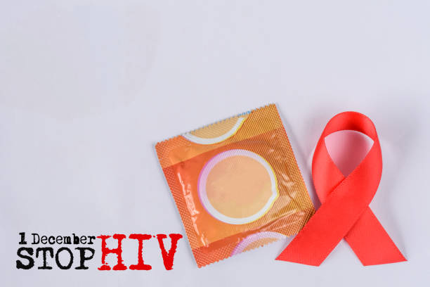 Soft focus red AIDS awareness ribbon on white background. World Aids day concept.