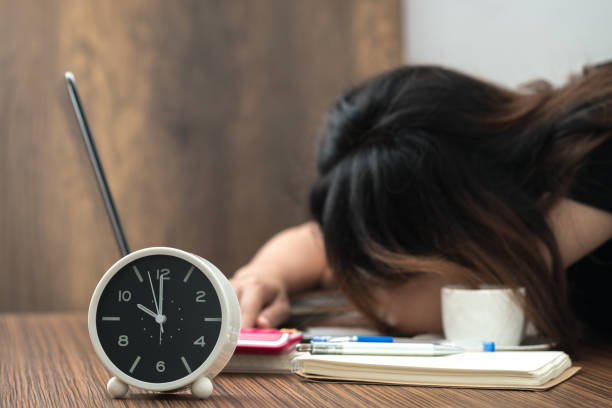 istock Overtime work. Exhaused female in office. 883577632