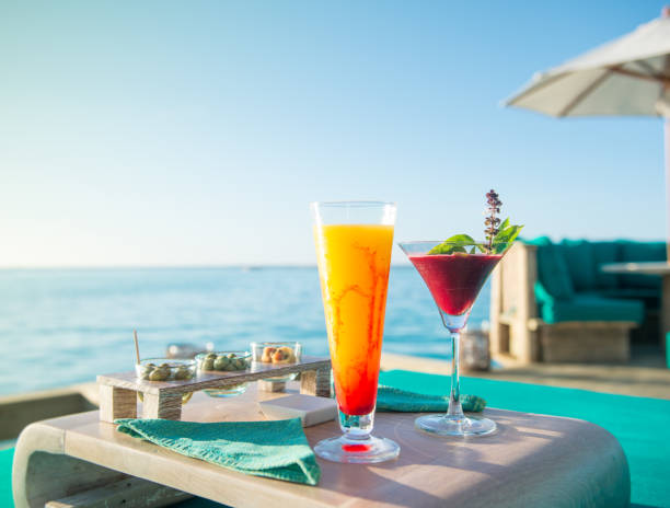 sunset cocktails by the sea