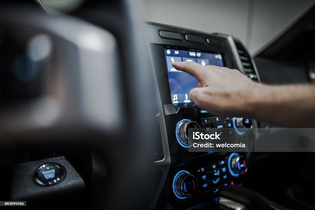 Car Multimedia System Setting Up Modern Vehicle Multimedia System. Streaming Audio in a Car. Car Stock Photo