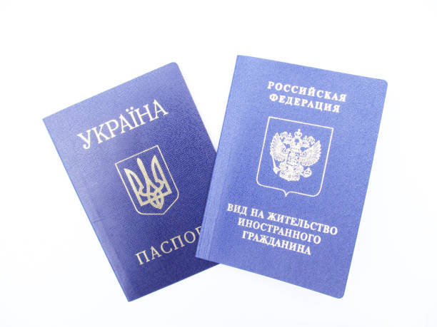 istock Ukrainian passport and Russian residence permit 883596054
