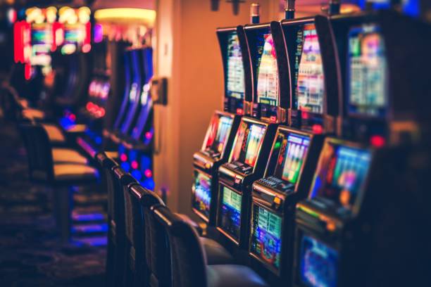 Rows of Casino Slot Machines Rows of Casino Slot Machines with Shallow Depth of Field. Las Vegas Gambling Theme. casino stock pictures, royalty-free photos & images