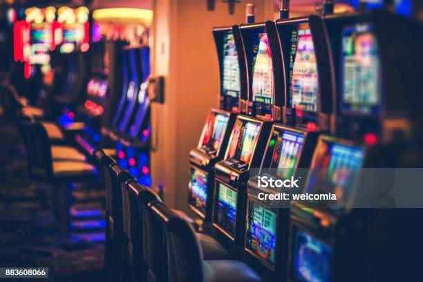 Rows Of Casino Slot Machines Stock Photo - Download Image Now - Casino, Slot Machine, Gambling