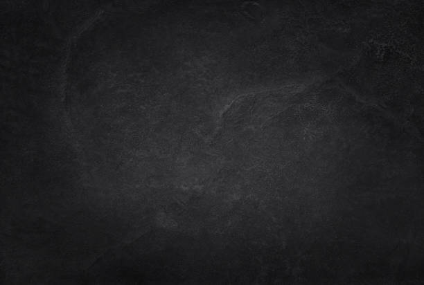 istock Dark grey black slate texture in natural pattern with high resolution for background and design art work. Black stone wall. 883612568