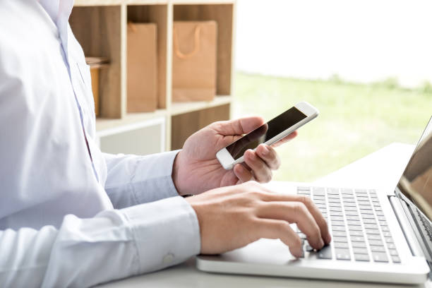 istock happiness man using smart phone register payments online shopping and customer service network connection market, technology on laptop, Internet Online shopping or banking concept, credit ,debit 883630446
