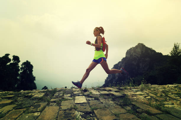 istock young woman trail runner running on the great wall 883662518