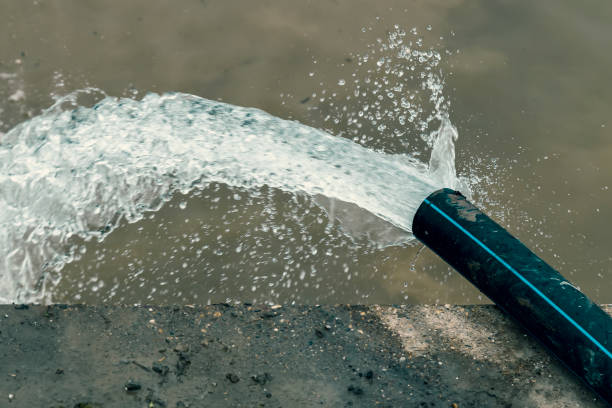 istock Pumping flood water into the river 2 883669006