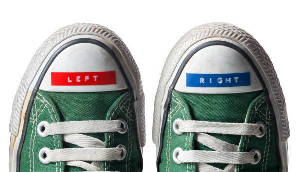 Right and left sneakers Right and left shoes on background. left wing politics stock pictures, royalty-free photos & images