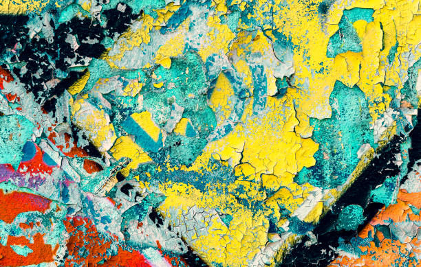 istock Cracked and peeling sprayed paint of an old wall 6 883684242