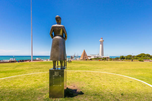 Napier, New Zealand – November 18, 2022: The rear view of A Wave in Time, a sculpture by Mark Whyte, opened in 2010 showing a young woman named Sheila Williams with a greyhound
