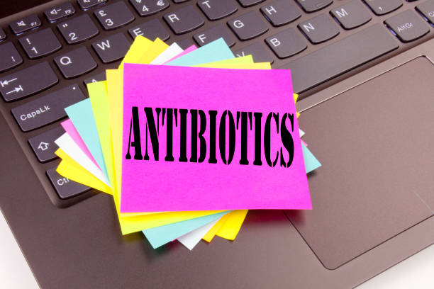istock Writing Antibiotics text made in the office close-up on laptop computer keyboard. Business concept for Health care Prescription drug medication Workshop on the black background with copy space 883695868