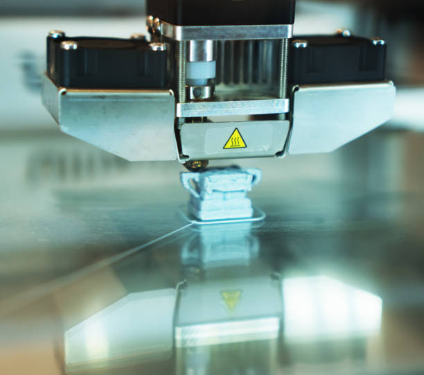 istock Head of industrial 3d printer in action. 883703044