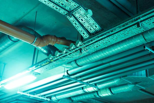 istock Cables and Pipes in Underground Parking 883703384