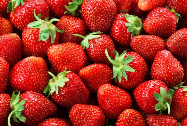 Photo of Strawberry background. Strawberries.