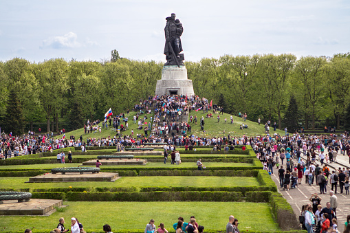 BERLIN - MAY 09, 2015: Victory Day in Treptower Park. Many visitors to lay flowers at the monument to the Liberator Soldier