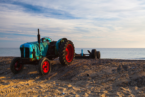 Old rusty tractor used to lauch fishing boats to sea at Cromer,Great Britain