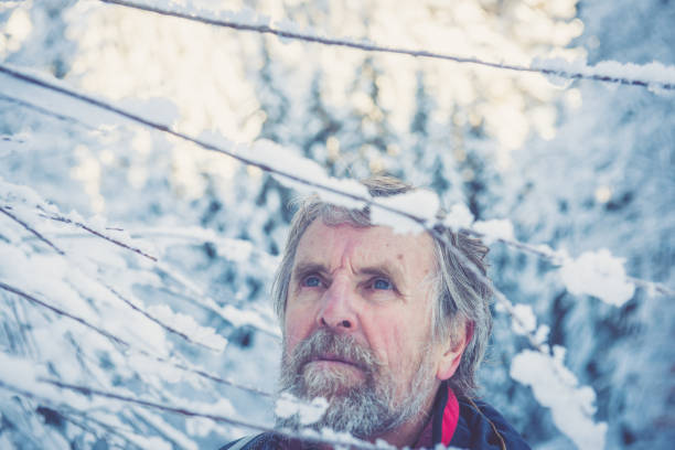 istock Senior Mountaineer in Alps, Winter 883707624