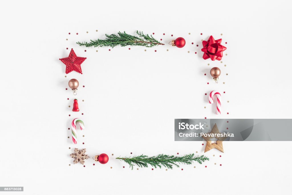 Christmas composition on white background. Flat lay, top view Christmas composition. Frame made of christmas tree branches, red and golden decorations on white background. Flat lay, top view, copy space Christmas Stock Photo