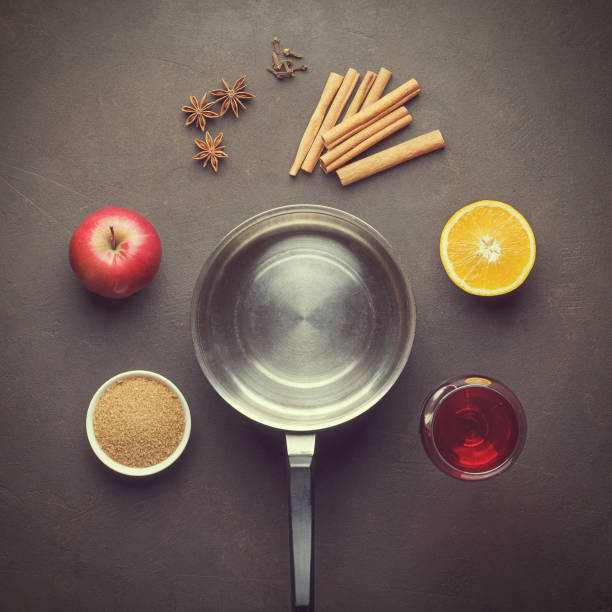 istock Culinary background with ingredients for mulled wine on brown table. 883714370