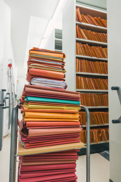istock Stacked files on a cart 883718740