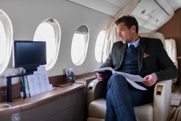 человек в частном самолете - vehicle interior corporate jet jet private airplane стоковые фото и изображения