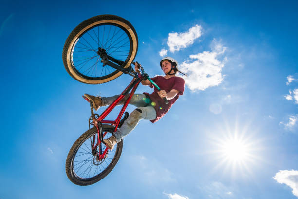 istock Woman enjoying dirt jumping sport 883738862