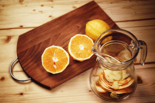 istock Citrus hot drink hand made from oranges and lemons 883739886