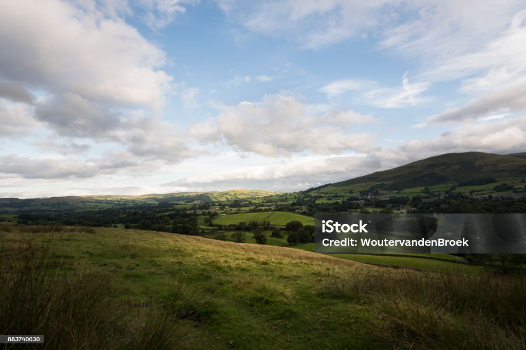 Green countryside of England around Sedbergh town The golden hills above the town of Sedbergh England Agricultural Field Stock Photo