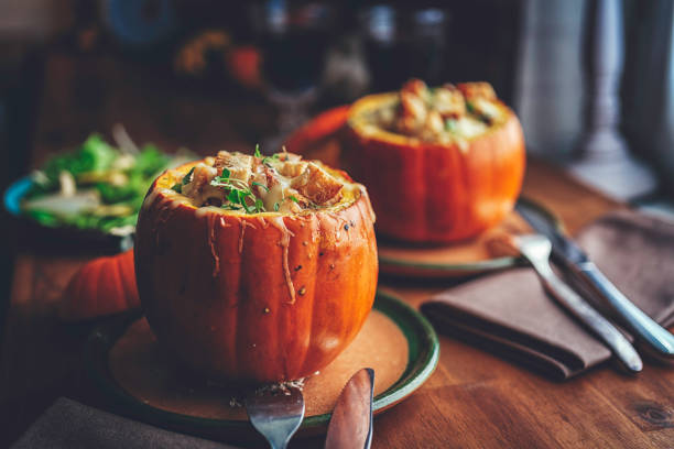 Pumpkin Risotto Baked with Cheese in a Pumpkin Pumpkin Risotto Baked with Cheese in a Pumpkin squash soup stock pictures, royalty-free photos & images