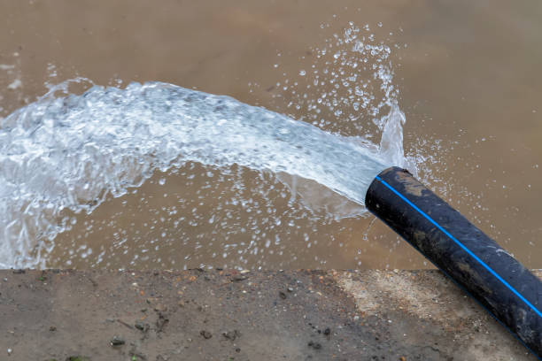 istock Pumping flood water into the river 883743854