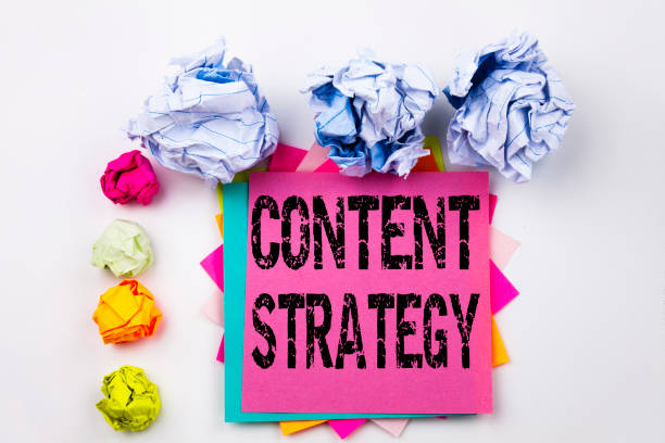 istock Writing text showing Content Strategy written on sticky note in office with screw paper balls. Business concept for Network Website Information Management on the white isolated background. 883744372