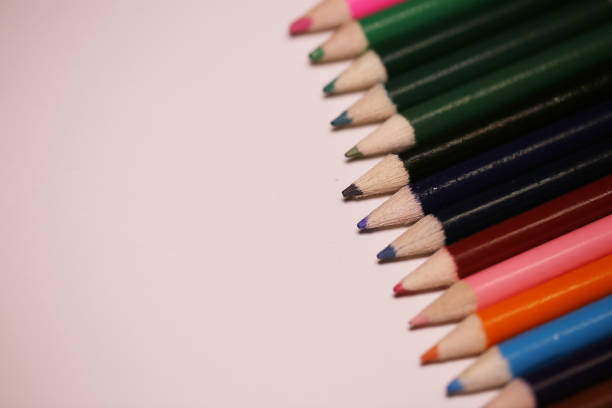 istock Multicolored pencils on the table. A stack of colored pencils ti 883744460