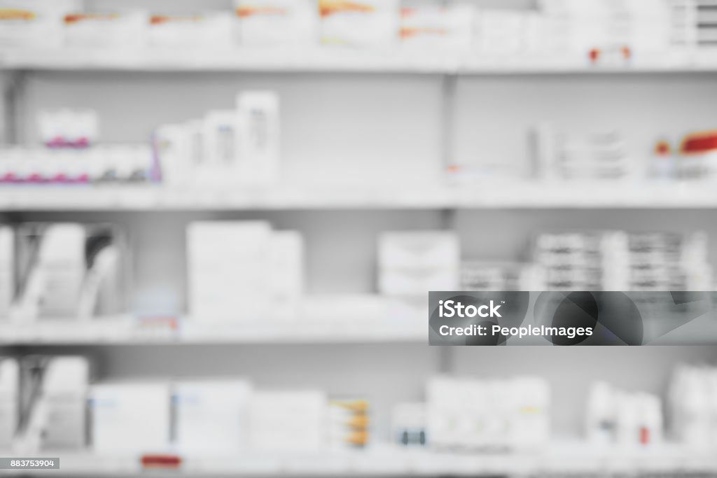What a selection Shot of a shelf full of medication  and medication boxes all neatly placed next to each other in a pharmacy Pharmacy Stock Photo