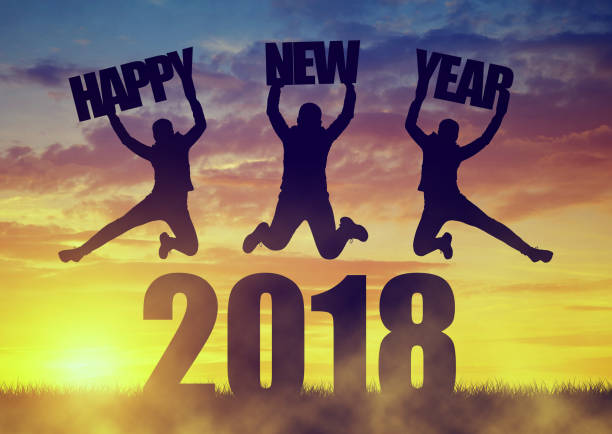istock Girls jumps up while celebrating New Year 2018. 883766562