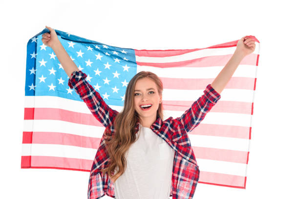 istock young woman with american flag 883766610