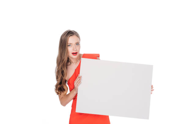 istock young woman with blank banner 883767460