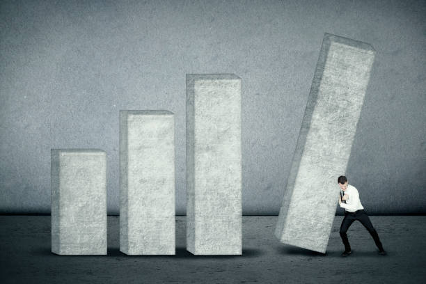 istock Businessman builds financial bar chart 883769604