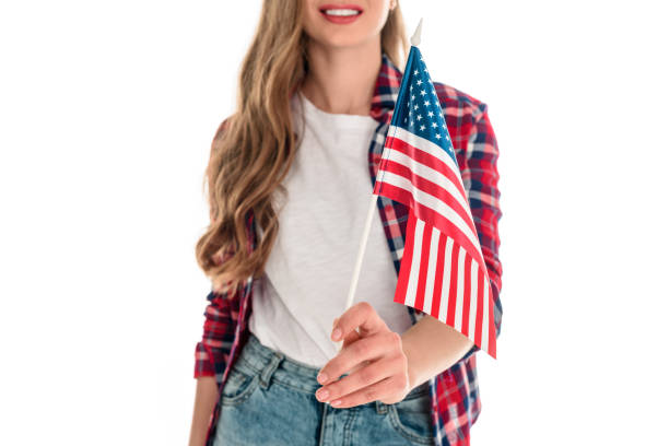 istock young woman with american flag 883770282