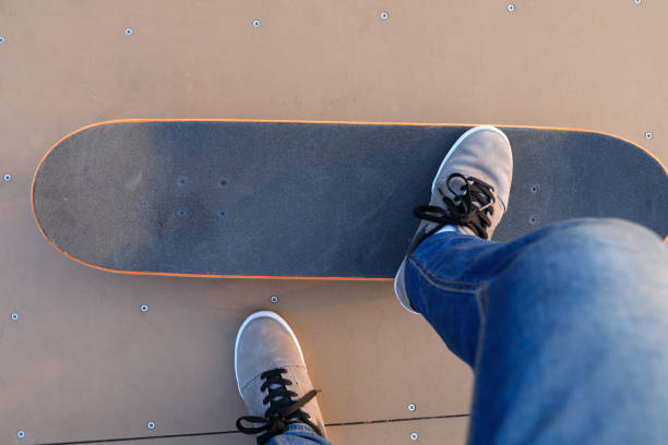 istock skateboarder legs skateboarding on skatepark ramp 883771396