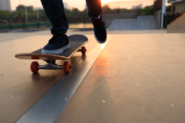 istock skateboarder legs skateboarding on skatepark ramp 883772050