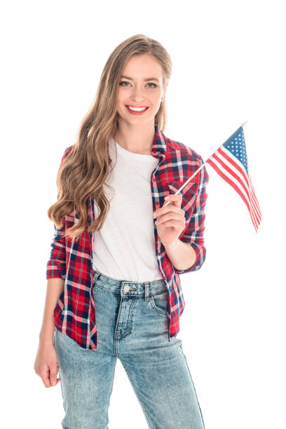 istock young woman with american flag 883774572