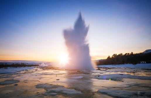 Famous Geysir in Iceland in beautiful sunset light. One of the most famous natural heritage on Iceland.